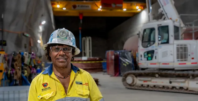 Ross Rosas in the underground cavern wearing high visibility safety uniform at the Genex Kidston Hydro Pumped Storage Project