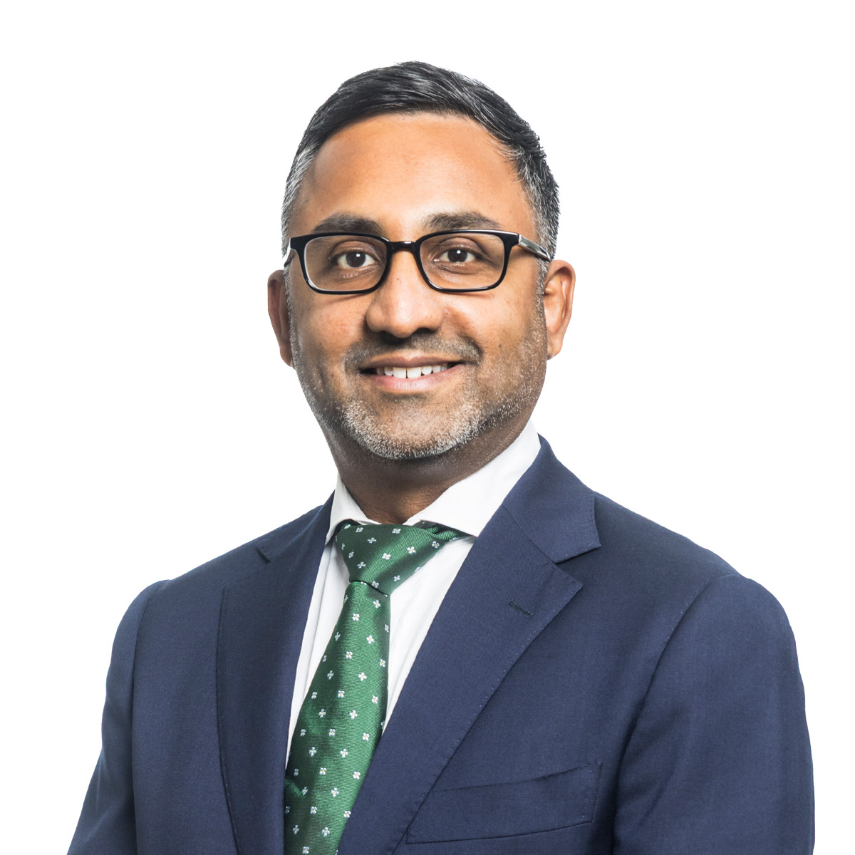 Raveen Sritharan wearing a suit and blue tie