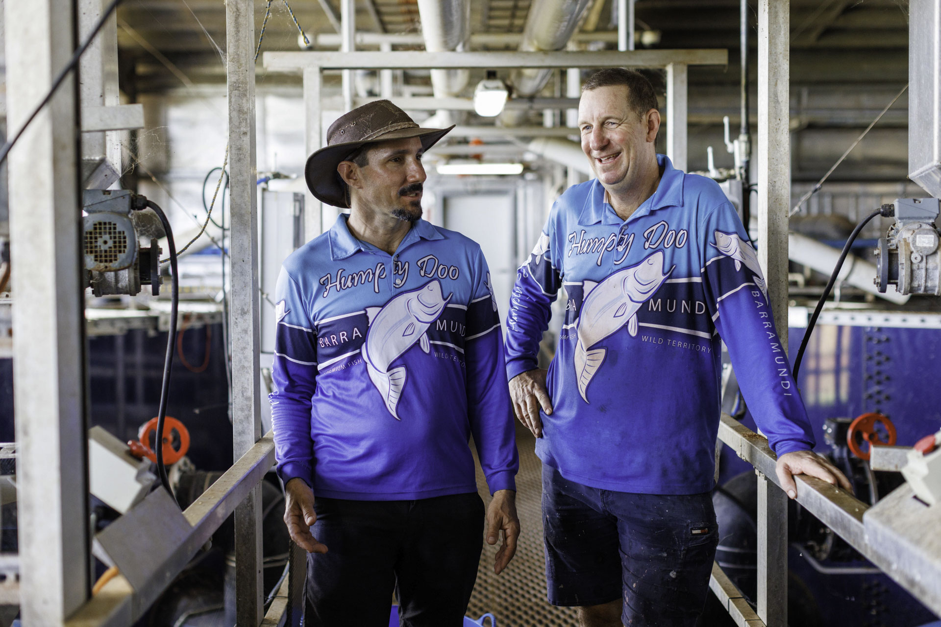 Humpty Doo Barramundi CEO Walking Through The Processing Plant Talking To A Coworker