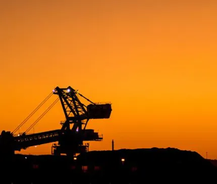 sunset and outline of mining machinery government partnership to support jobs and investment in Northern Territory