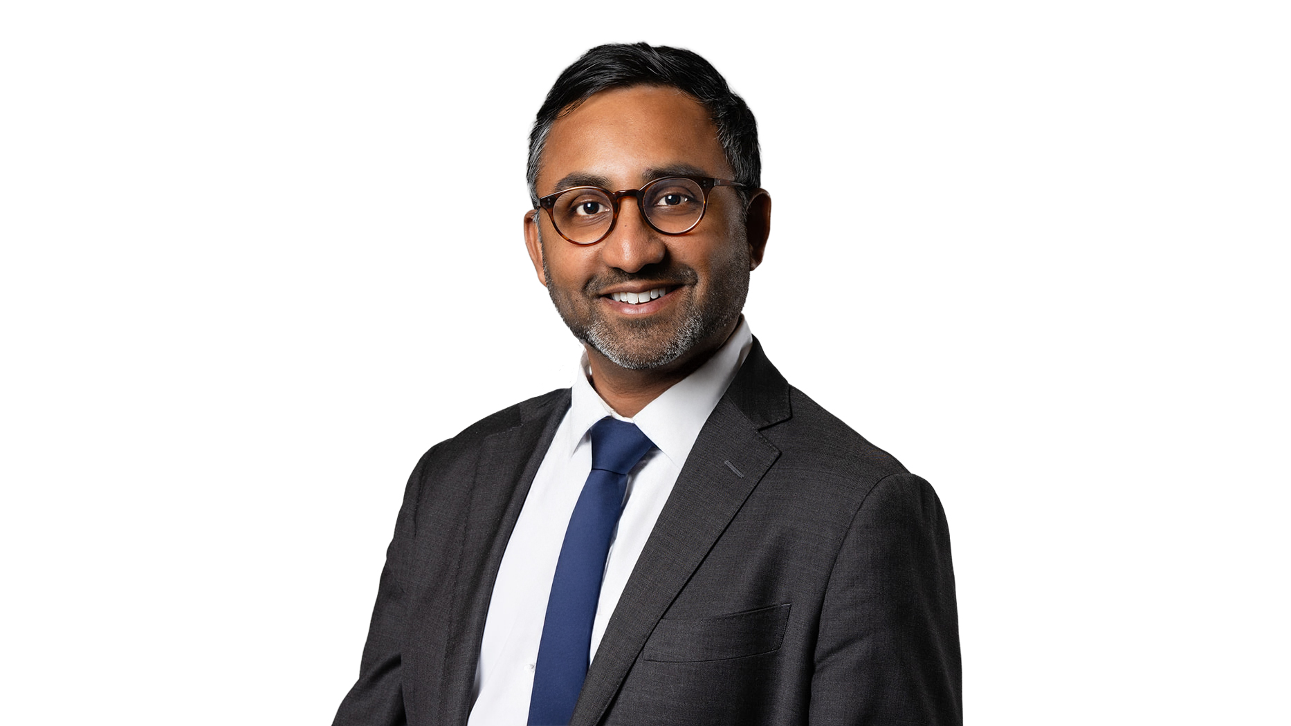 Raveen Sritharan wearing a suit and blue tie