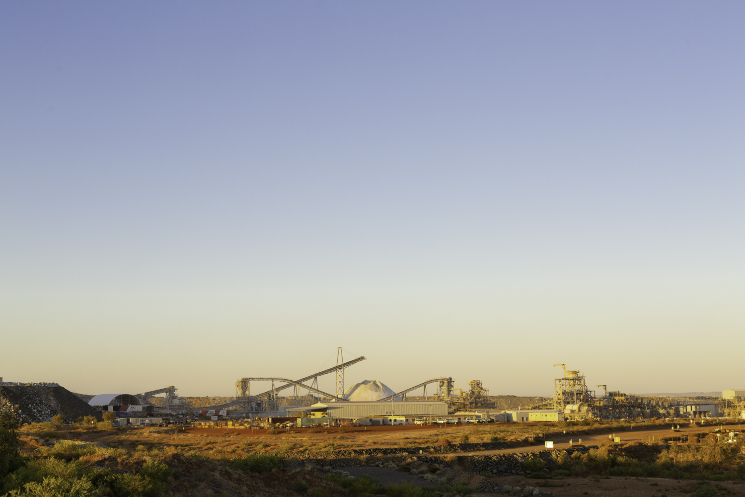 Pilbara Minerlas P680 Expansion Wide View Of Mine Site With Conveyor Belts Mounds Of Product And Processing Plant