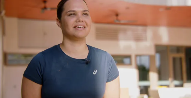 JCU Occupational Therapy student Jaydah Savage talking to cameras in front of the JCU Halls of Residence project