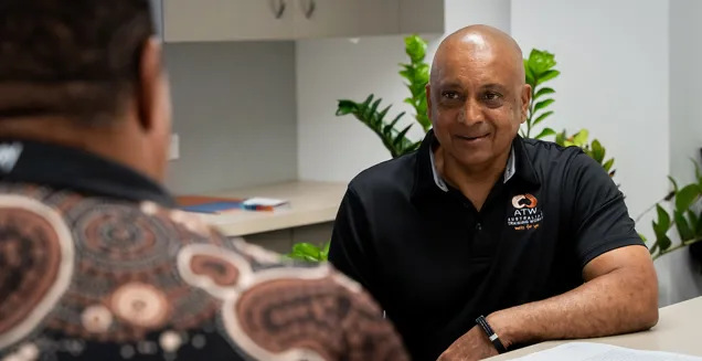 Tony Martens at the Australian Training Works office speaking to their Indigenous Liaison Officer