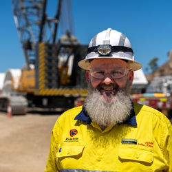 Sean Hughes wearing PPE glasses, hat, shirt at the Genex Power Kidston Pumped Storage Hydro Project