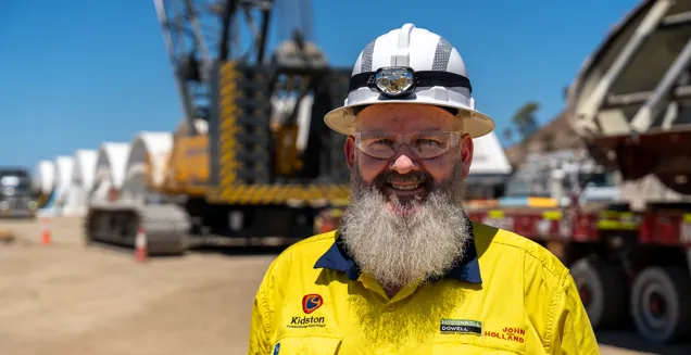 Sean Hughes wearing PPE glasses, hat, shirt at the Genex Power Kidston pumped storage hydro project