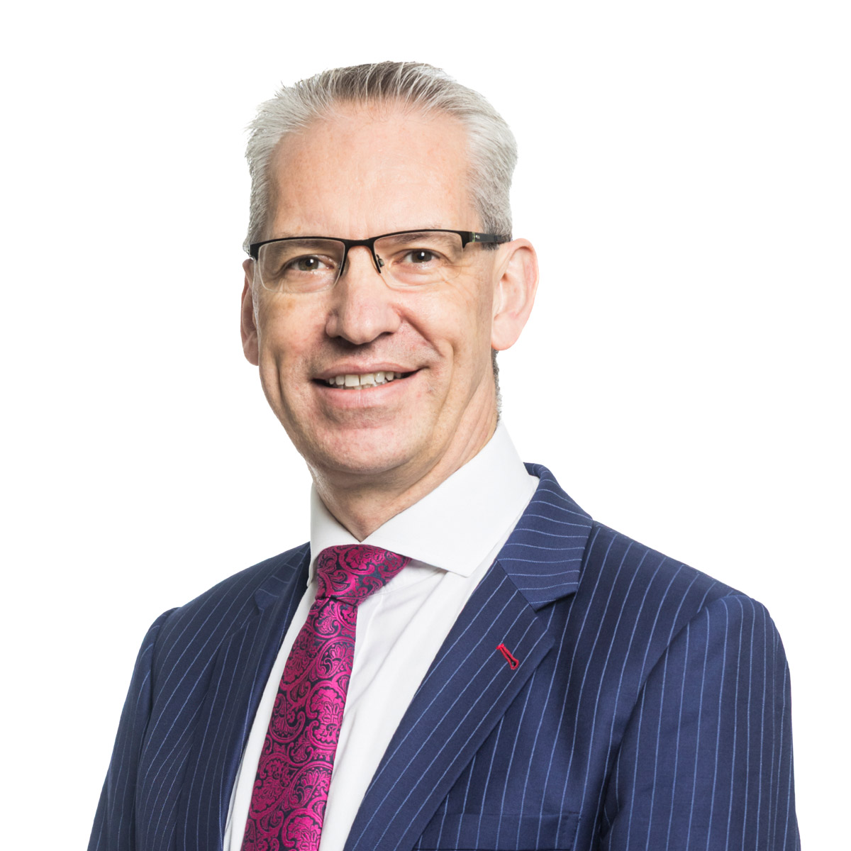 Neil MacDonald wearing suit and tie