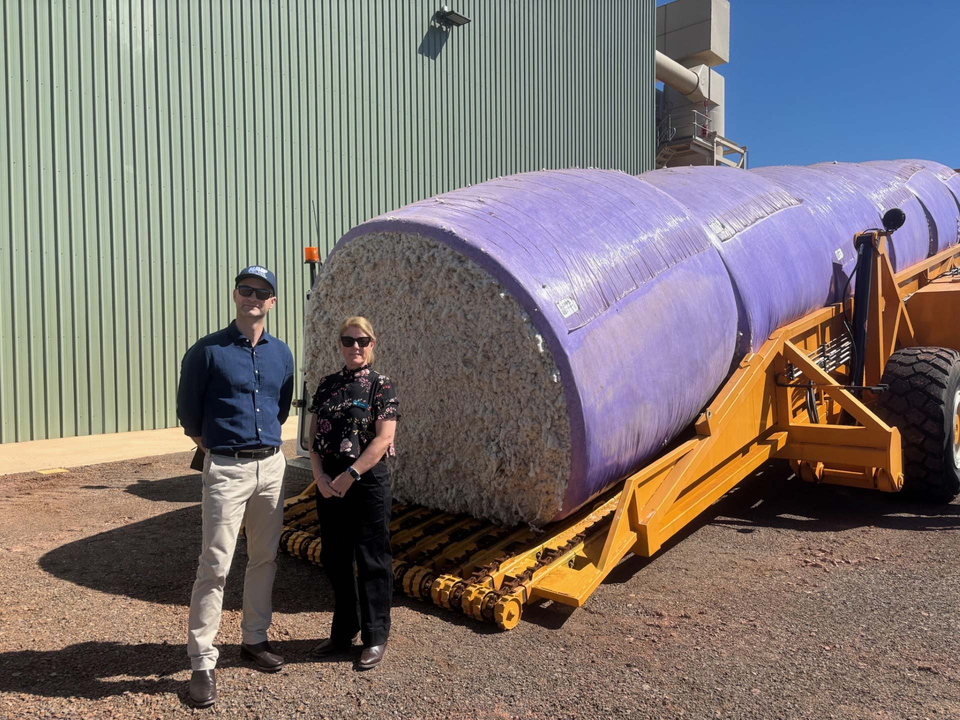 Louie Trajkoski and Tracey Hayes at the Kimberley Cotton Gin standing in front of the first delivery of cotton